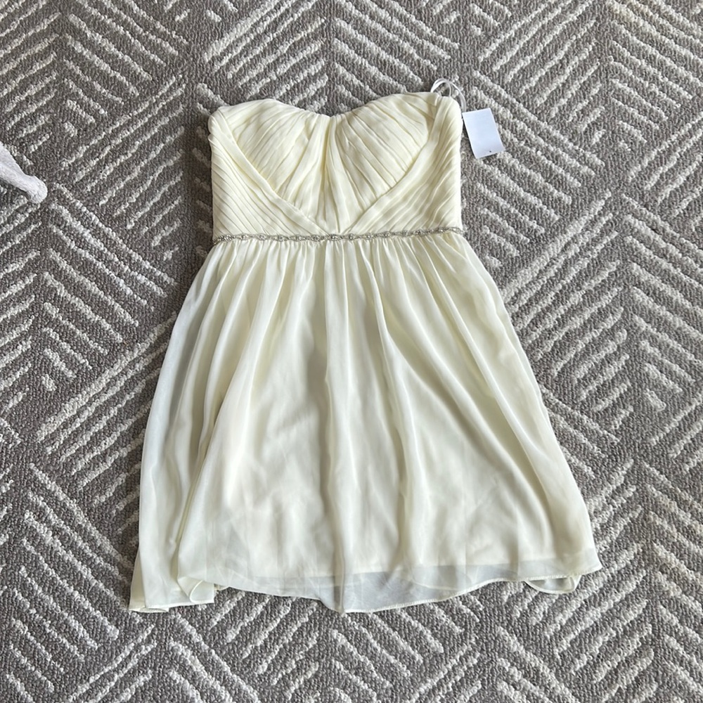 NWT a.drea ivory party dress.  Built in bra with no slip rubber